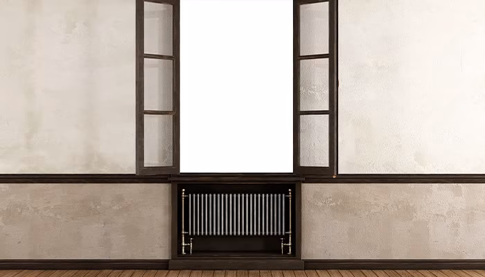 Ventana abierta revela un fondo blanco brillante, enmarcado por paredes beige texturizadas. Un radiador oscuro se ubica debajo, en un suelo de madera liso. No hay texto visible.