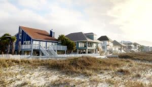 Casas de playa elevadas permanecen tranquilas en un ambiente costero, rodeadas de dunas de arena y vegetación escasa, con un cielo parcialmente nublado y luz suave de atardecer.